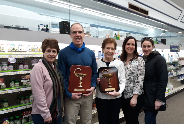 Troy Spaulding and his family, holding Bowl of Hygeia award